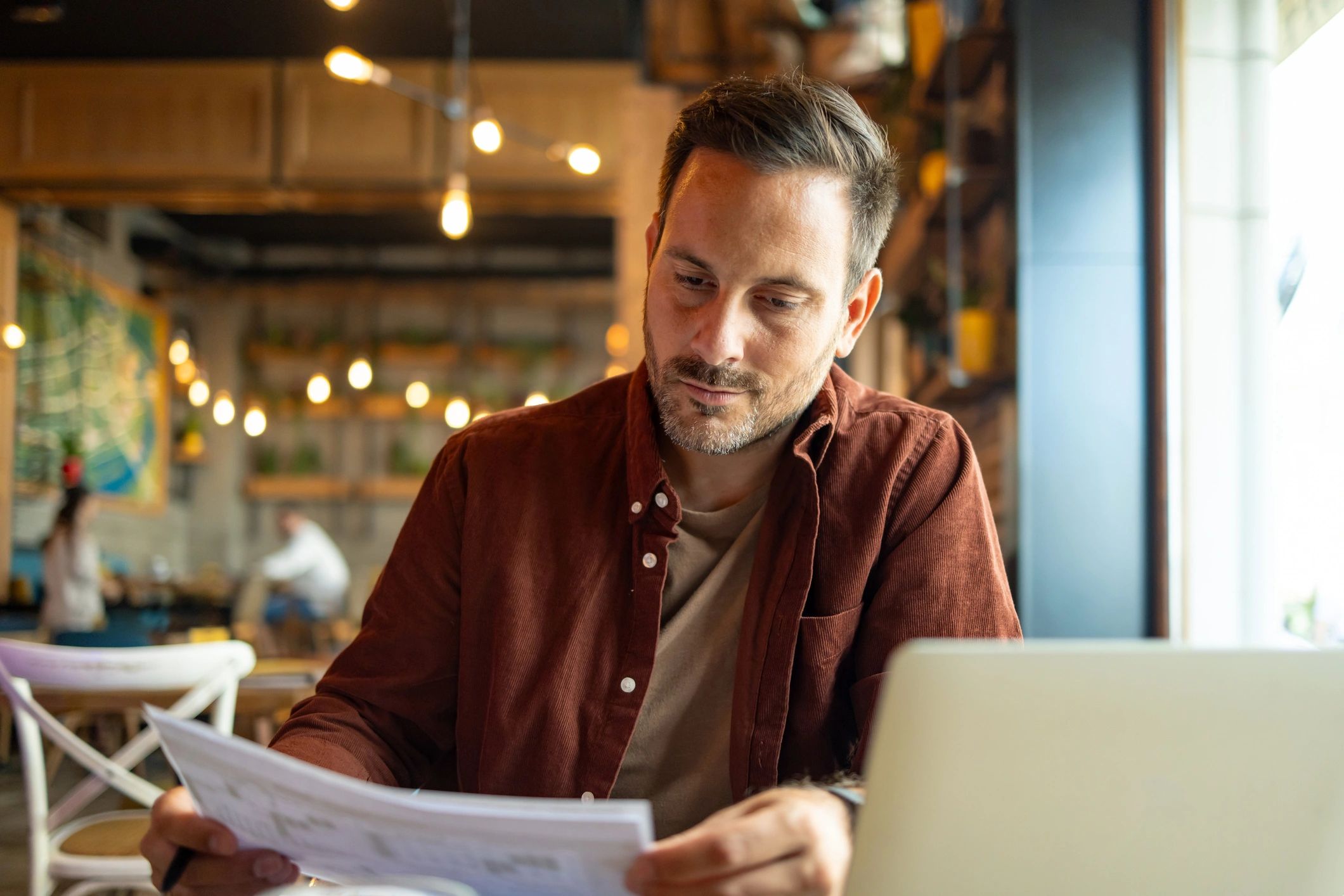 Customer working near documents and device while seeking printer support
