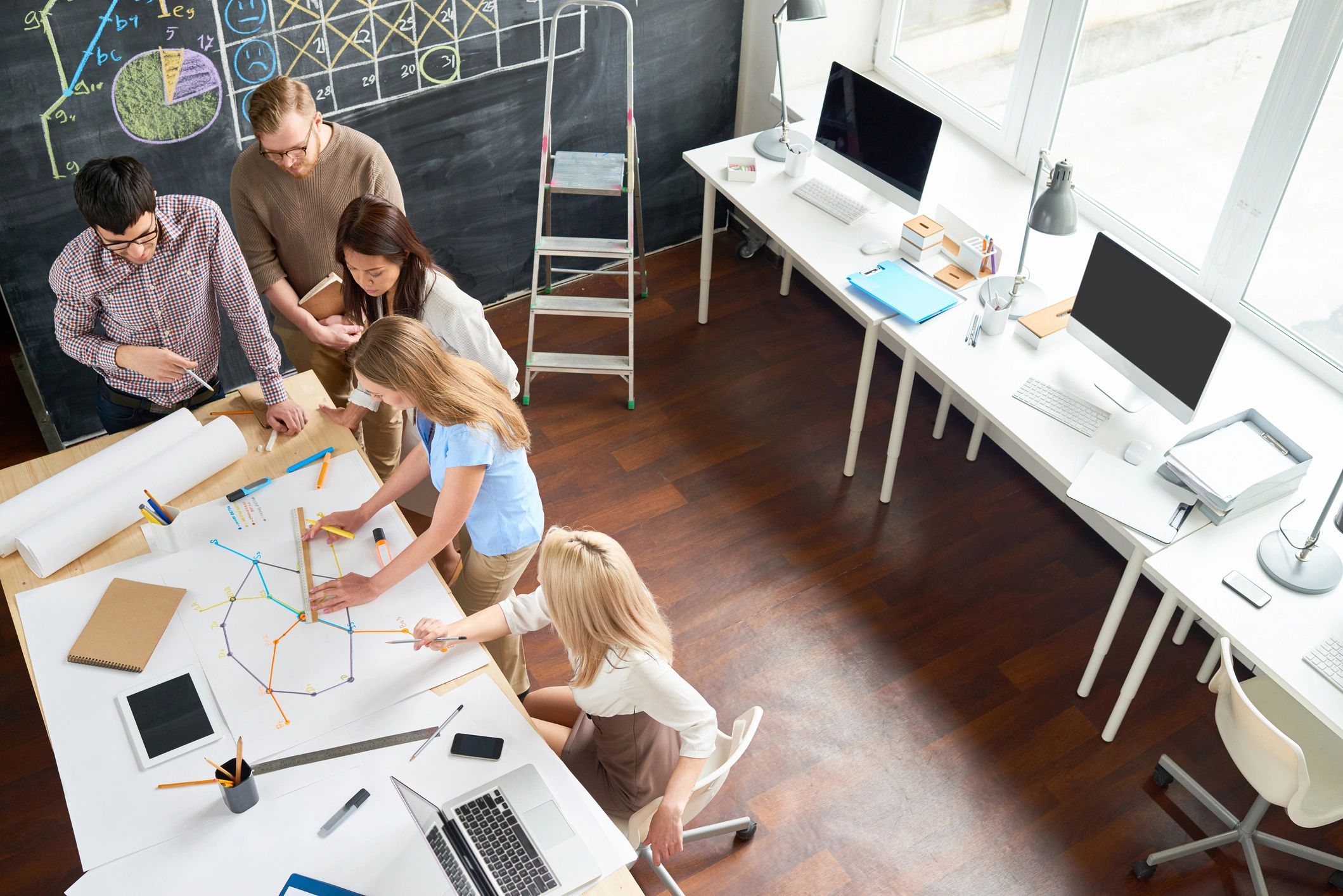 Printer support team collaborating in a modern office workspace